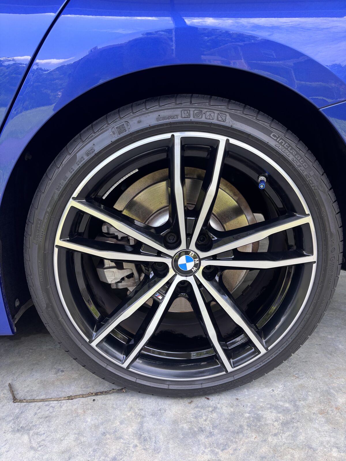 Spotless wheel and dressed tire on a BMW 3 Series after detail