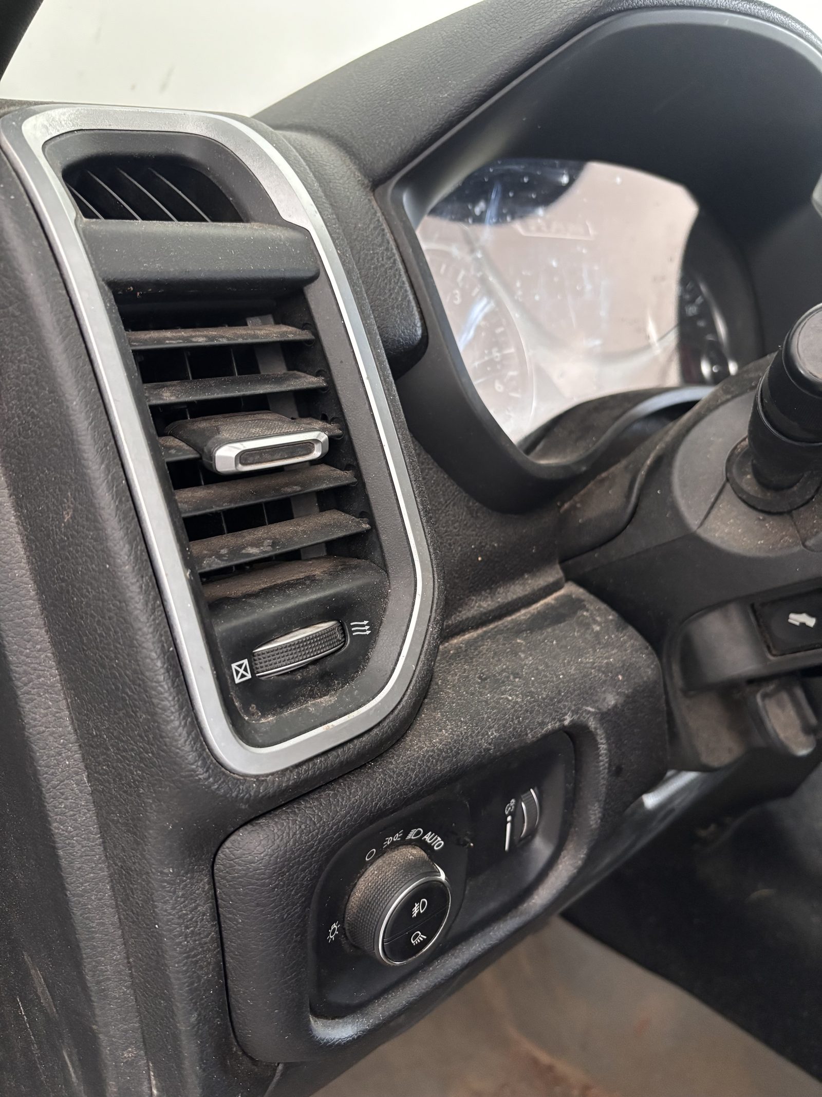 Dusty dash vents and console before interior detail — RAM 1500