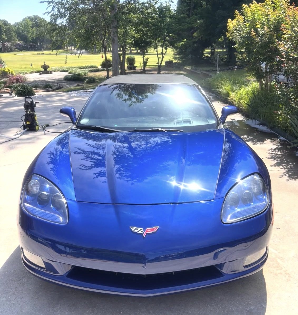 Blue Corvette front end shining after wash and wax